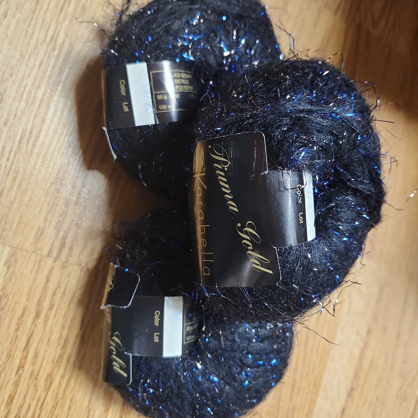 Karabella Yarns Piuma Gold - black with blue and gunmetal sparkle